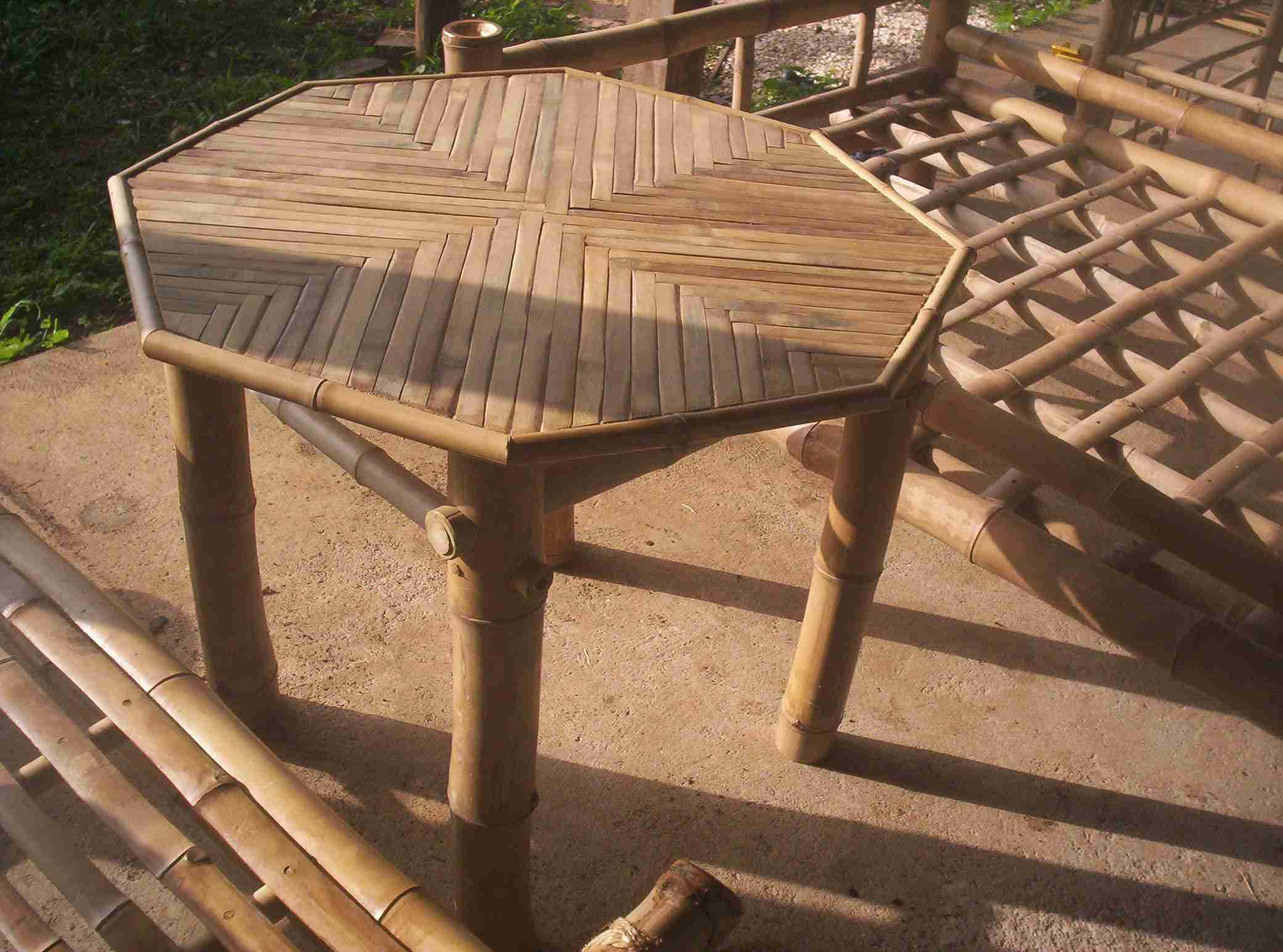 Octagonal table with a patterned split-bamboo top and bamboo legs