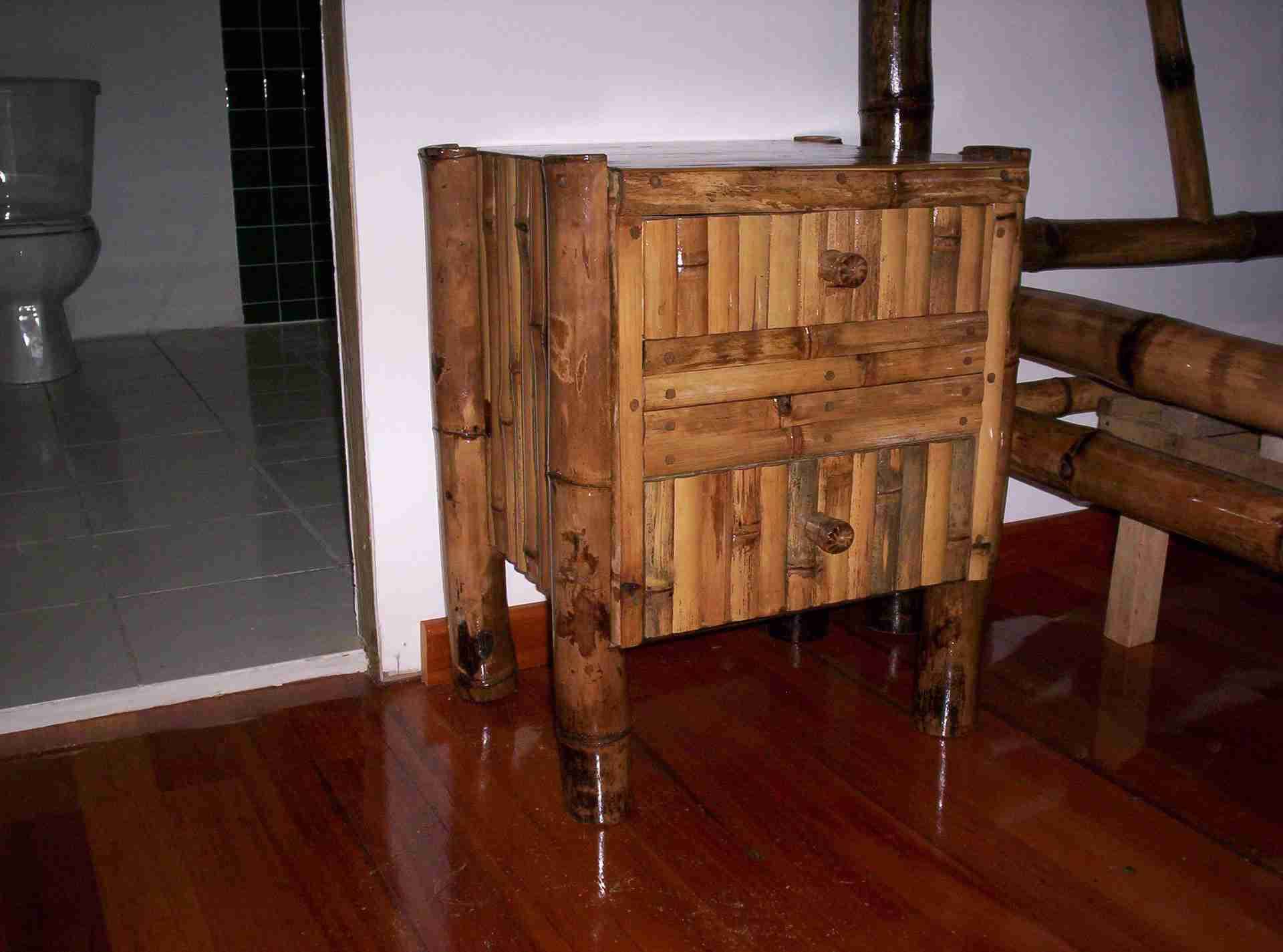 Nightstand with two drawers faced in bamboo slats and thick bamboo legs