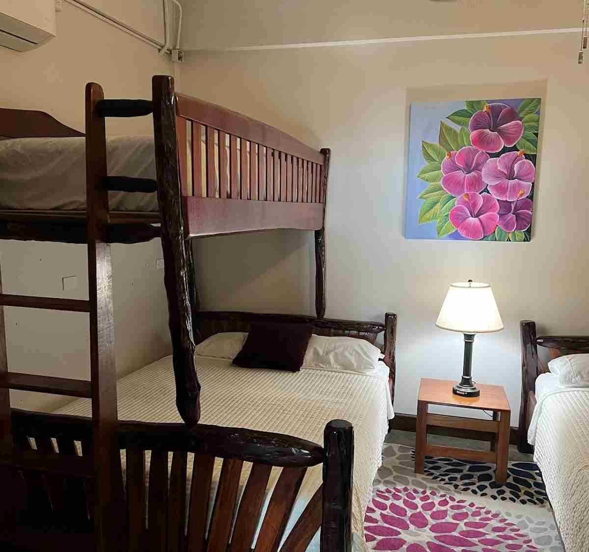Hardwood bunk bed with a queen bed below and an XL twin above