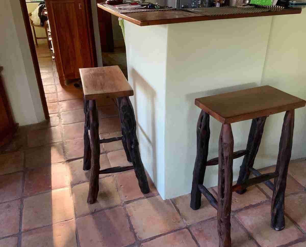 Set of hardwood bar stools with organic logwood legs