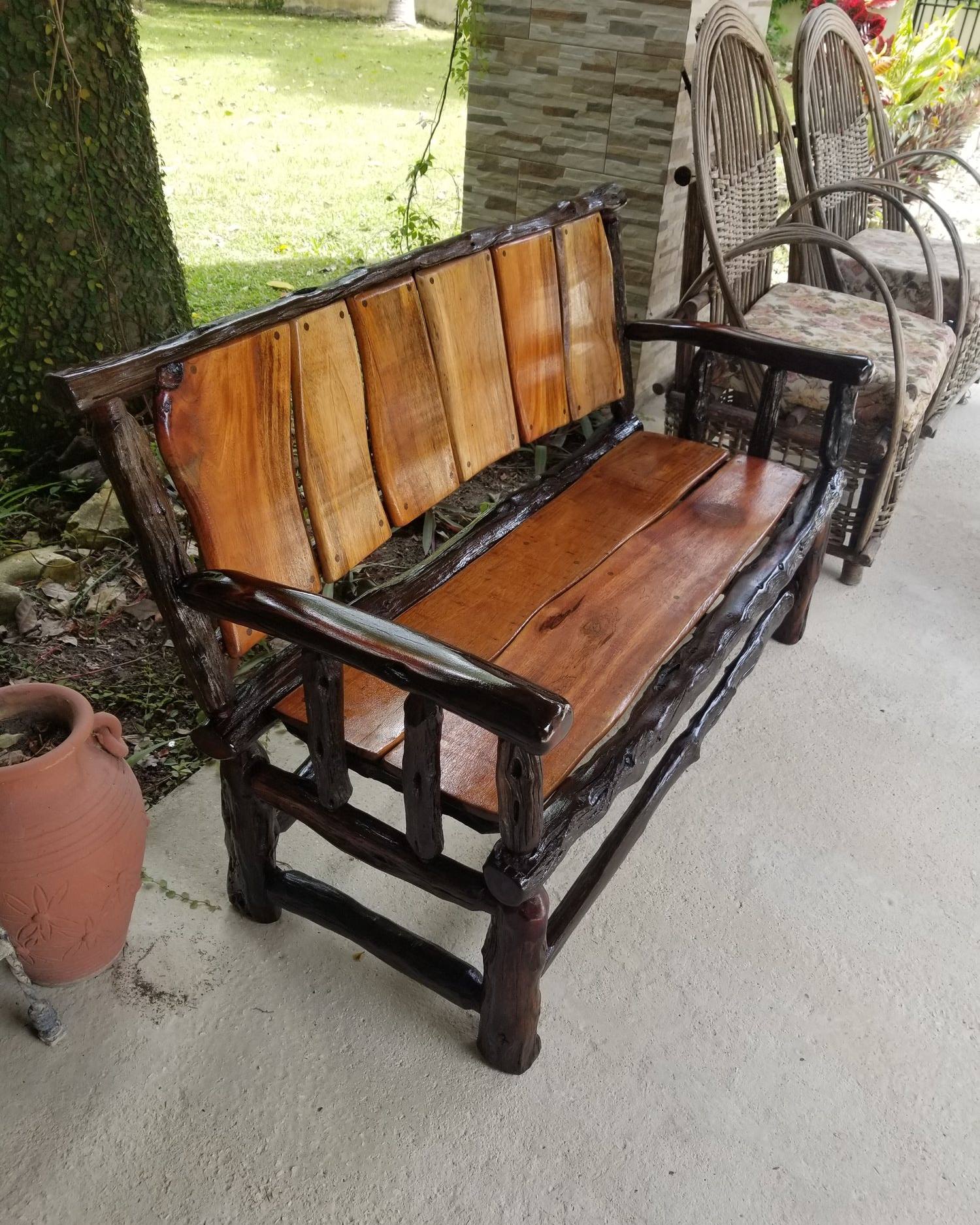 Hardwood and logwood bench on a covered veranda