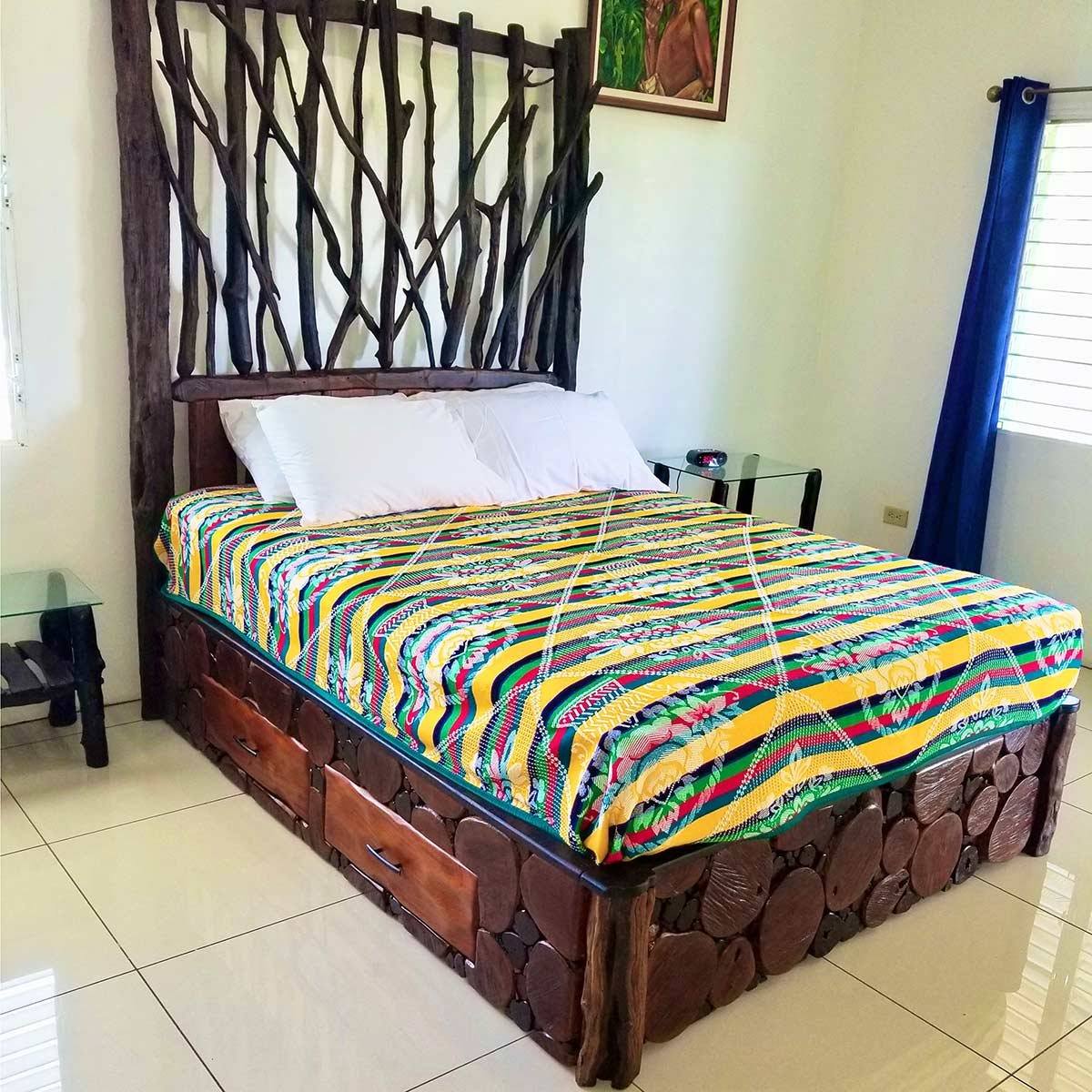 Queen Bella bed with a spindled logwood headboard and mahogany frame